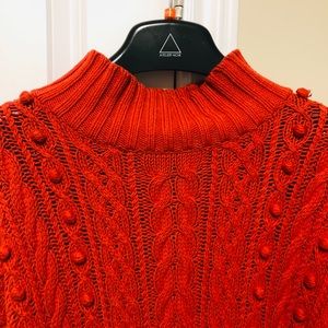 Red cable knit sweater